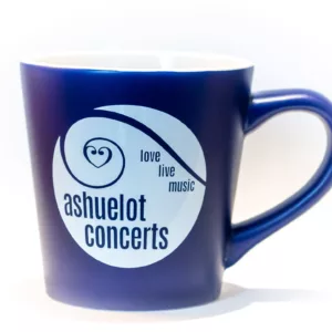 The Ashuelot Concerts Mug - Blue is a dark blue ceramic mug featuring a white circular logo with "ashuelot concerts" and "love live music" in blue text; the mug has a white interior.