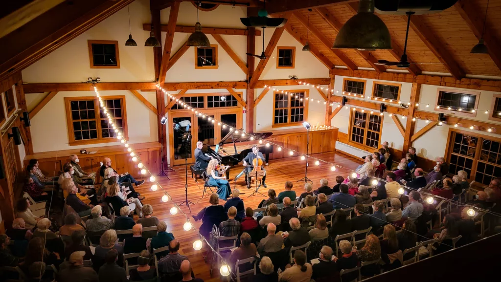 Experience all 11 concerts, including the full Winter Festival, with the 2024-25 Full Season Ticket. Enjoy performances in a cozy hall under warm string lights, creating an intimate atmosphere for every show.